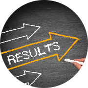 Word 'RESULTS' highlighted in bright orange chalk on a dark chalkboard, with two white arrows pointing right, symbolizing direction and progress; a hand holding chalk emphasizes action and achievement, with circular framing for a polished look.