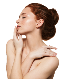 Young woman with a serene expression and gently closed eyes, featuring long, red hair styled in an elegant bun. Soft lighting highlights her smooth, radiant skin, accentuating her natural glow. Her graceful posture includes one hand gently touching her face while the other wraps around her arm, conveying an intimate and contemplative mood. The transparent background focuses attention on her figure and expression, creating an overall sense of calm and beauty.